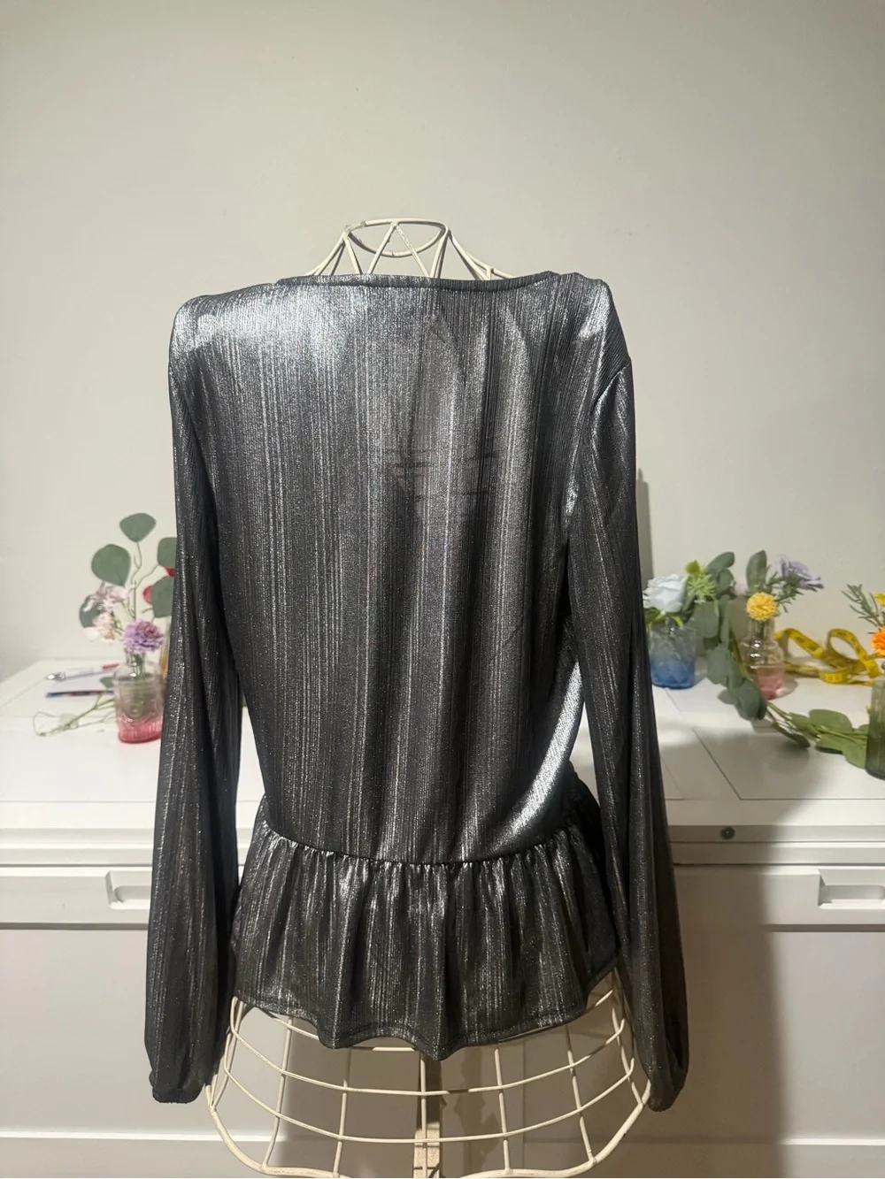 BOLD elements Shimmery Black Twist-Front Peplum Blouse